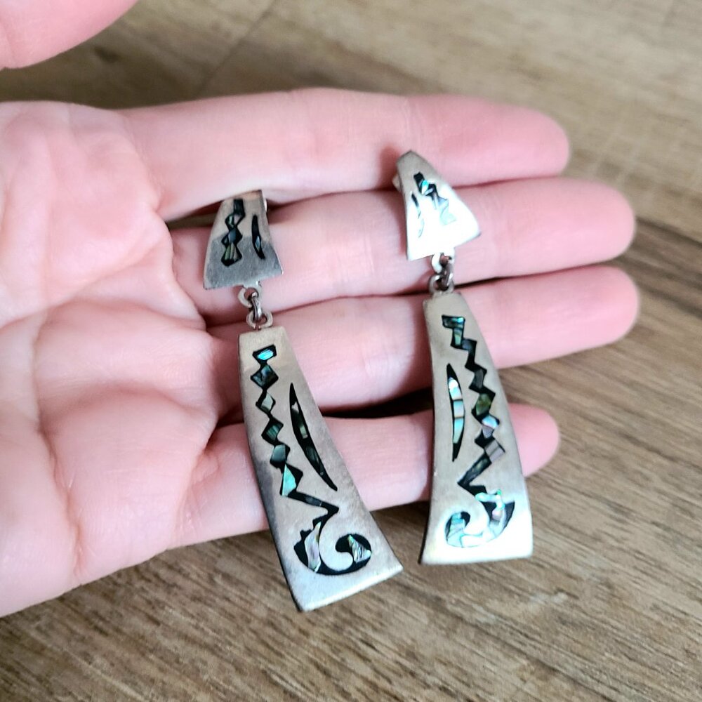 Large sterling silver statement dangling earrings with abalone shells.